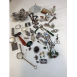 A quantity of costume jewellery and other collectible items including half dolls, brooches,micro