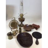 A brass Aladdin lamp together with a Swiss wooden carved musical dish, an early plastic moulded