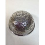 A vintage white metal bowl decorated with naive bird images W:13cm x H:6cm