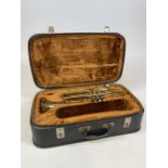 A brass trumpet in fitted case, engraved COR-TON. Made in Czechsovakia.