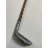 An early hickory shafted golf putter. FORE.. length 90cm.