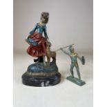 A cast metal statue on marble oval plinth also with a brass statue of a centurion. H:31cm