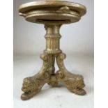 A small cast iron gilt sprayed table base with lion head feet. H:39cm