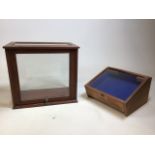 Two table top display cases - one with angled front and felt lining W:42cm x D:24cm x H:39cm largest