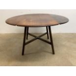 A circular Ercol style drop flap table. Unstamped. W:113cm x D:113cm x H:72cm