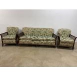 A bergere three seater sofa with two arm chairs. Some damage to cane. Arm chairs W:76cm x D:87cm x