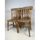 A set of four elm seated farmhouse country kitchen chairs.