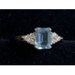 A 9ct gold, diamond and aquamarine ring. Size N.