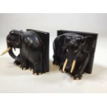 A pair of heavy carved ebony elephant book ends W:16cm x H:15cm