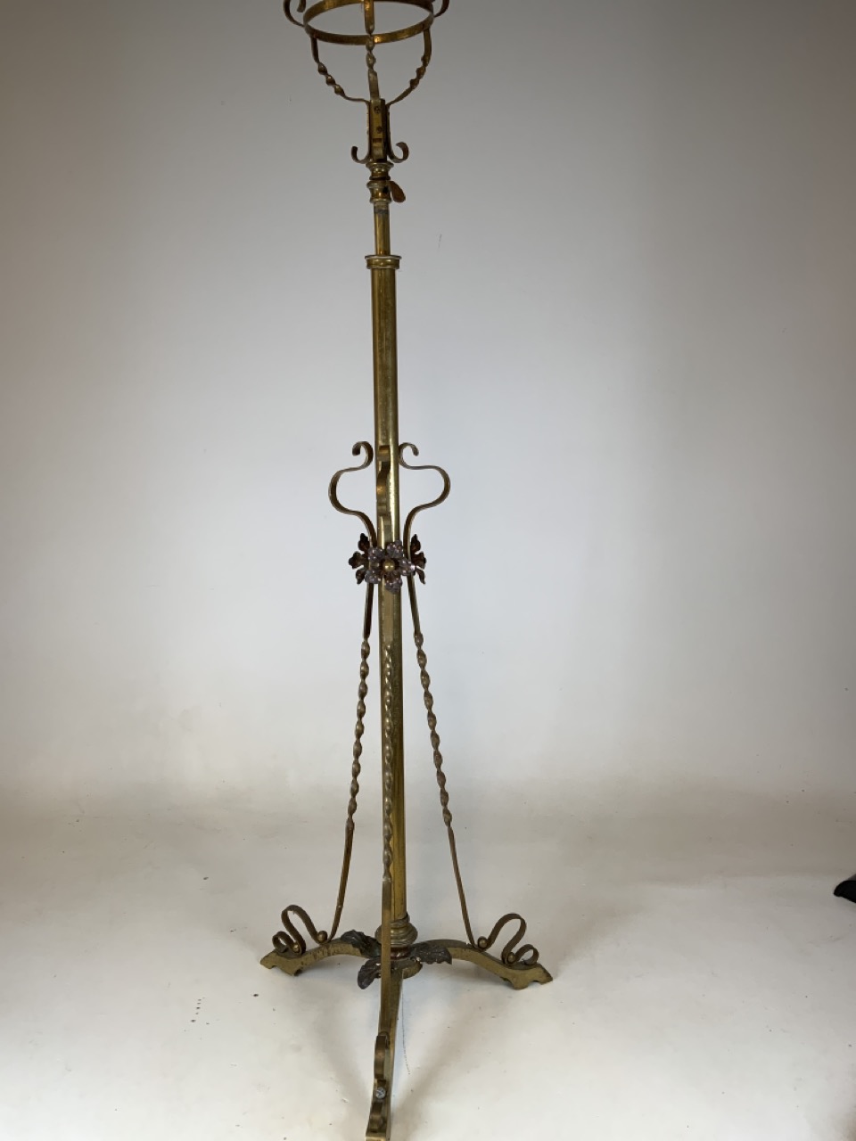 An adjustable brass art Nouveau style tripod lamp base. H:141cm