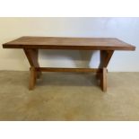 A chunky pine dining table with 2.25inch soild top, X frame legs with stretcher bar and pegs. W: