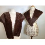 A fur shoulder cape with jacquard lining together with a fur neck stole