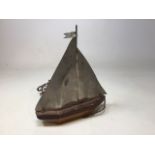 An Art Deco lamp styled as a yacht with wooden base and metal sails W:28cm x H:32cm