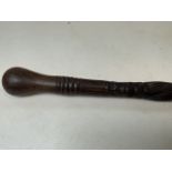 A 19th century African hardwood carved stick. H:89cm