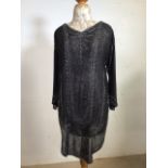 A beaded tunic circa 1920s. Heavily beaded to front and back