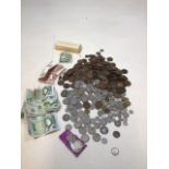 A collection of old coins and bank notes including some Victorian florins