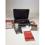 A Bundy Oboe in fitted case serial number B 27287 with reedsan oboe book and other accessories