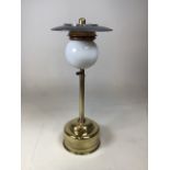 A Vintage brass Pork Pie Tilly lamp with long stem and white glass shade H:54cm