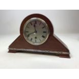 A Boodle & Dunthorne 1930s mantle clock in mahogany case with silvered face and black numerals.