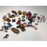 A quantity of mainly farm and construction related Dinky toys together with road signs, traffic