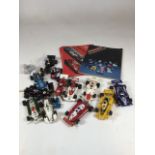 12 vintage Scalextric racing cars also with a catalogue