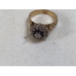 An 18 carat gold diamond and sapphire cluster ring with central diamond. Size N. Total weight 6