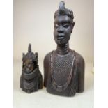 Two African ebony tribal carved heads. Largest H:40cm