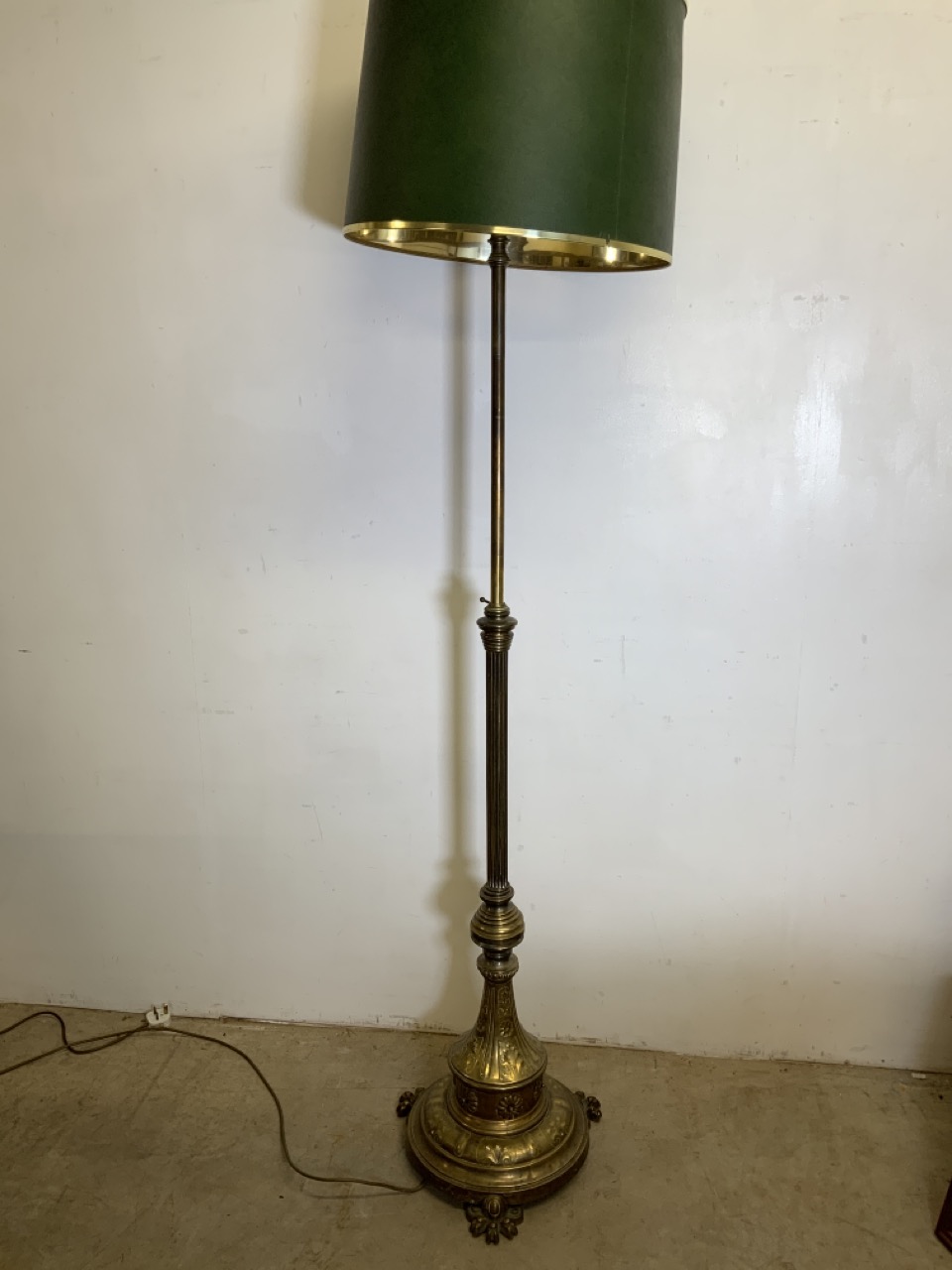 An adjustable early 20th century heavy brass standard lamp. H:174cm