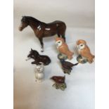 Beswick animals. Including standing horse 21cm damage to ear, a sitting horse, cat, Wren 993,