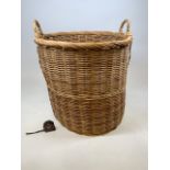 A large vintage wicker log or laundry basket. W:62cm x D:62cm x H:62cm