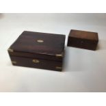 A rosewood writing box with brass bound edges, green tooled leather to the inside A/F, also with a