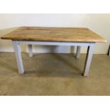 A pine kitchen table with painted base. W:165cm x D:110cm x H:80cm