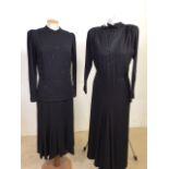 Two 1940s black crepe dresses. Mid calf dress with tie belt and beaded chiffon V neckline and padded