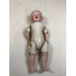 A bisque head doll with bisque arms and legs and kid leather body. Impressed 142 to back of head,