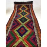 An old Sunni Kilim runner in vibrant colours