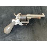 A Continental 7mm pin fire revolver with 6 shot double action. 18cm x 10cm