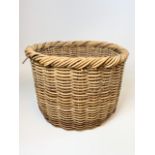 A vintage wicker log basket, W:54cm x D:54cm x H:38cm