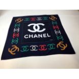 A printed silk square with Chanel logo , labelled silk, made in Paris. Machine rolled hem.