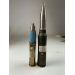 Two shell cases, Aden cannon shell 30mm also with an inert 30m from an anti tank jet.