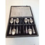 A boxed set of Victorian silver spoons and sugar nips with monogrammed handles 77gm