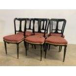 A set of six aesthetic movement black painted upholstery dining chairs.