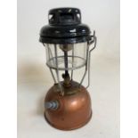 A copper and brass Tilley lamp with original Tilley glass shade. H:34cm