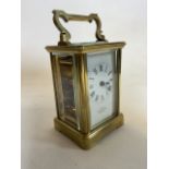 A Mappin and Webb Sheffield brass carriage clock with bevelled glass.