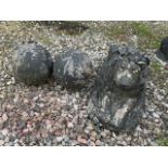 A pair of reproduction cannon balls also with a concrete lion. W:72cm x H:35cm