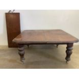 A Victorian mahogany extending dining table with extra leaf. 70cm wide planks. W:149cm x D:138cm x