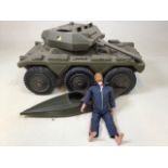 An action man A/F together with a Cherilea toy canoe and tank W:55cm x H:29cm Tank