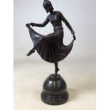 After Joe Descomp- Cormier (1869-1950) A bronze figure of a dancing girl holding skirt with raised
