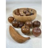 Treen fruit items in bowl, some with Arthur Cummings label verso.
