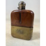 A vintage silver plate and leather hip flask with slide off silver plate cover. H:17cm