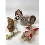 A Japanese battery operated dog with bone together with other vintage plush items including a